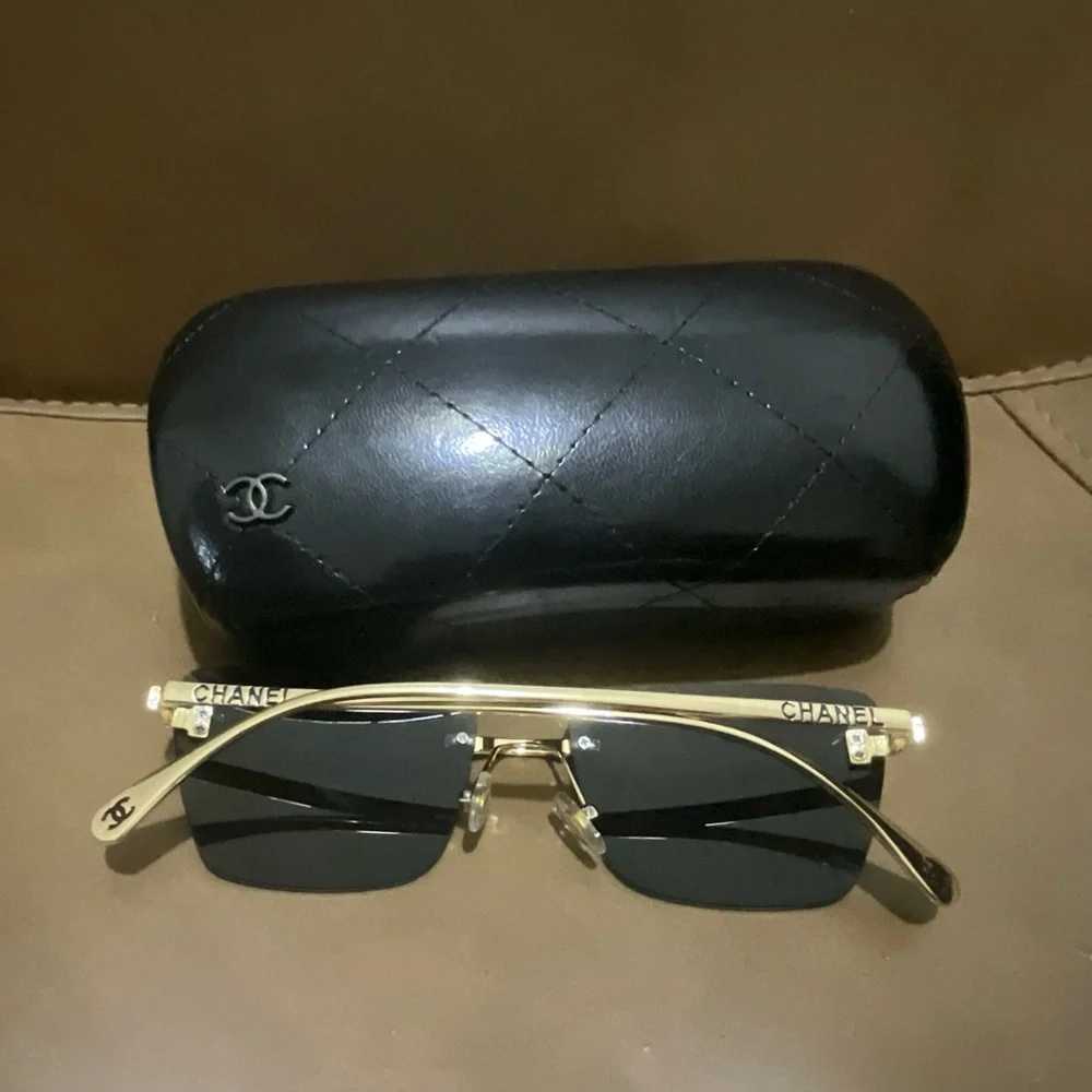 Chanel Women’s Black and Gold Sunglasses